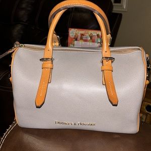Dooney & Bourke Satchel. Comes with crossbody  strap.